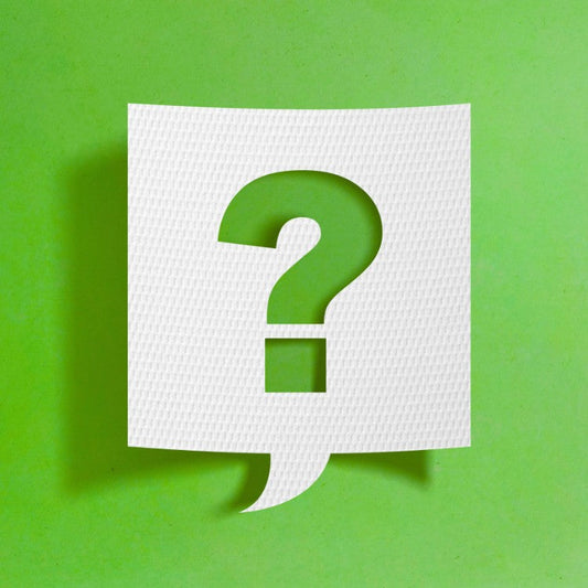 Point d’interrogation blanc découpé dans une bulle sur fond vert, illustrant l’article « D’où viennent les algues en aquarium ? »